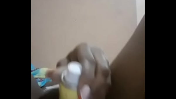 African hairy pussy fucking herself with a bottle